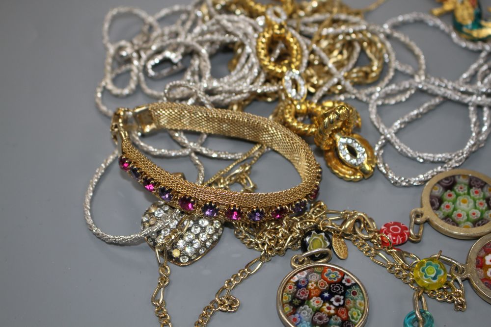 Seven assorted costume necklaces including a millefiore glass necklace, a costume bird brooch and bracelet with coloured paste stone